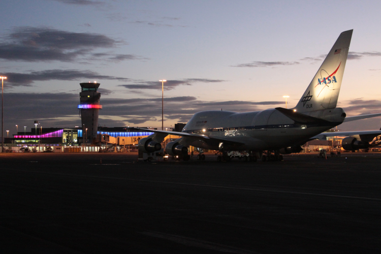 SOFIA on the National Science Foundation Antarctic Program Facility’s ramp facing the Christchurch International Airport terminal and tower.