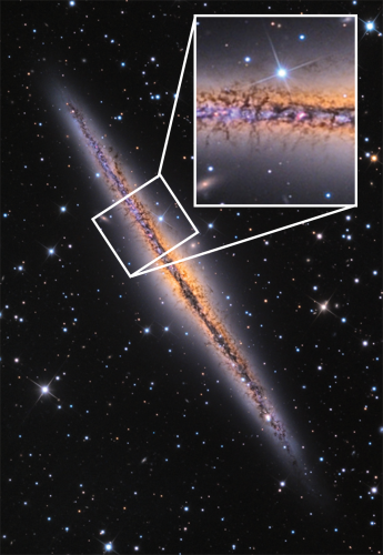 Optical image of the galaxy NGC 891 showing dark extinction features extending out from the midplane